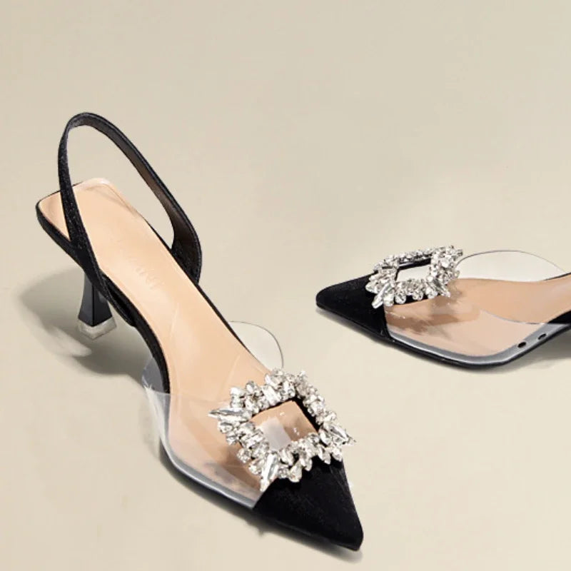 Black transparent heel sandals with bling buckle detail, perfect for stylish office and career occasions.