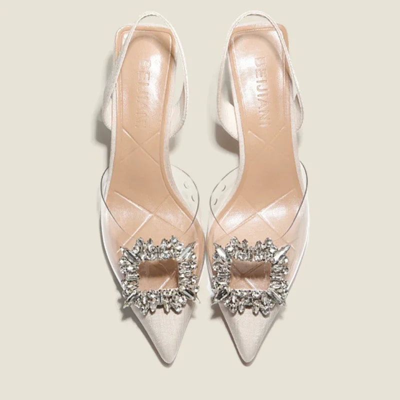 Summer women's transparent heel sandals with a bling embellishment, pointed toe design, and back strap style.
